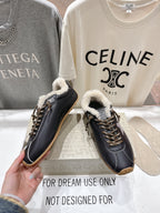 Golden Goose black leather sneakers with shearling collar and gold laces, gum soles