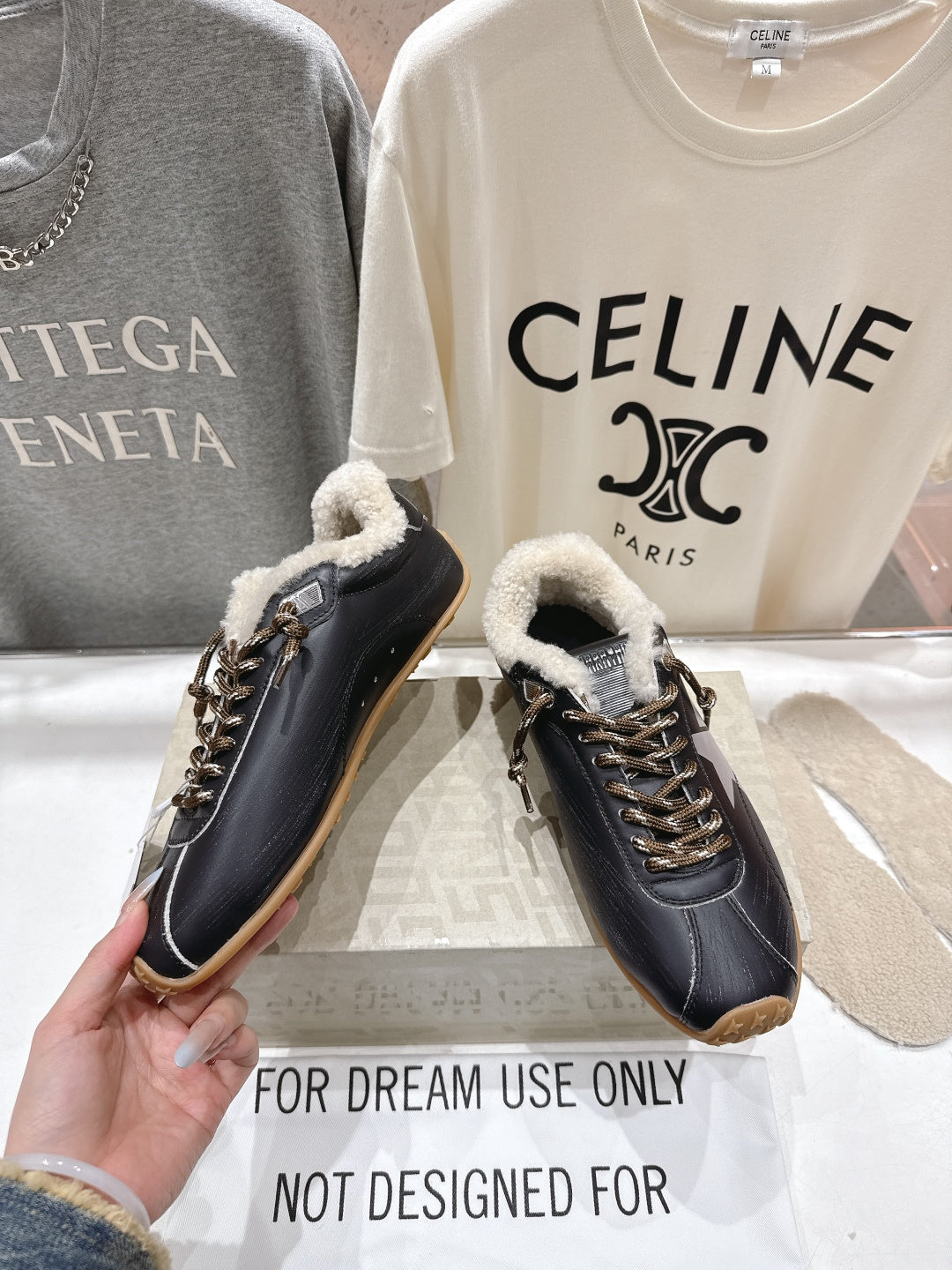 Golden Goose black leather sneakers with shearling collar and gold laces, gum soles