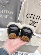 Golden Goose black sneakers with shearling-lined collars and gum outsoles