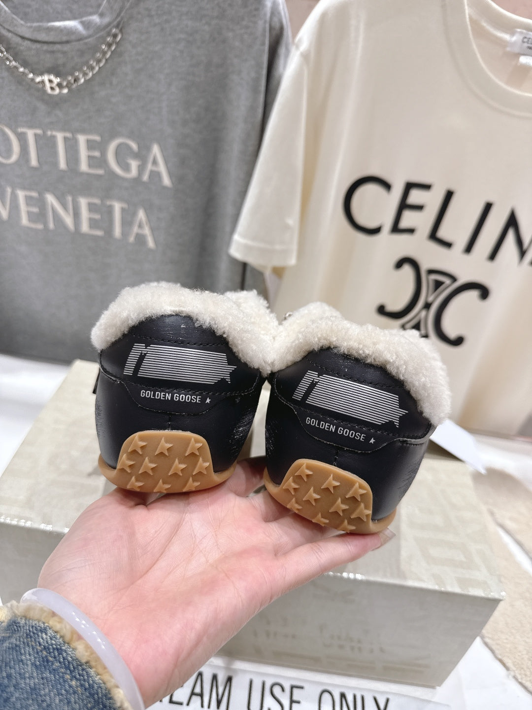 Golden Goose black sneakers with shearling-lined collars and gum outsoles