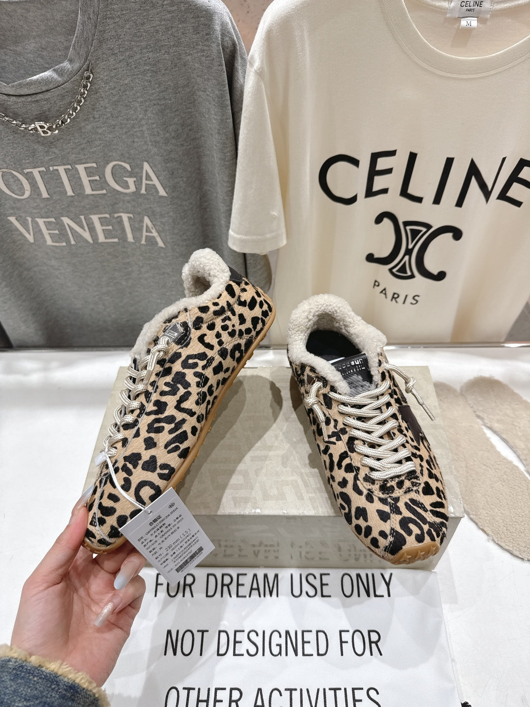 Leopard-print low-top sneakers with sherpa lining, white laces, gum outsole