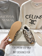Leopard-print sneakers showing outsole texture and sherpa-lined collar