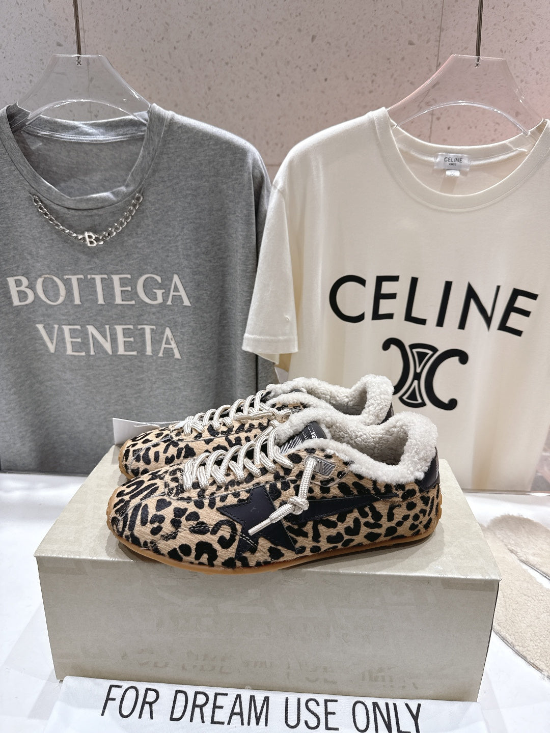 Leopard-print Golden Goose sneakers on display box, sherpa trim and white laces