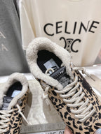Close-up of leopard-print sneaker with sherpa-lined collar and white laces