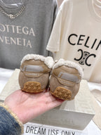 Golden Goose tan suede sneakers with shearling lining, rear view, star-embossed sole