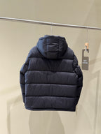Dark hooded puffer jacket back view with quilted stripes and stand-collar hood.