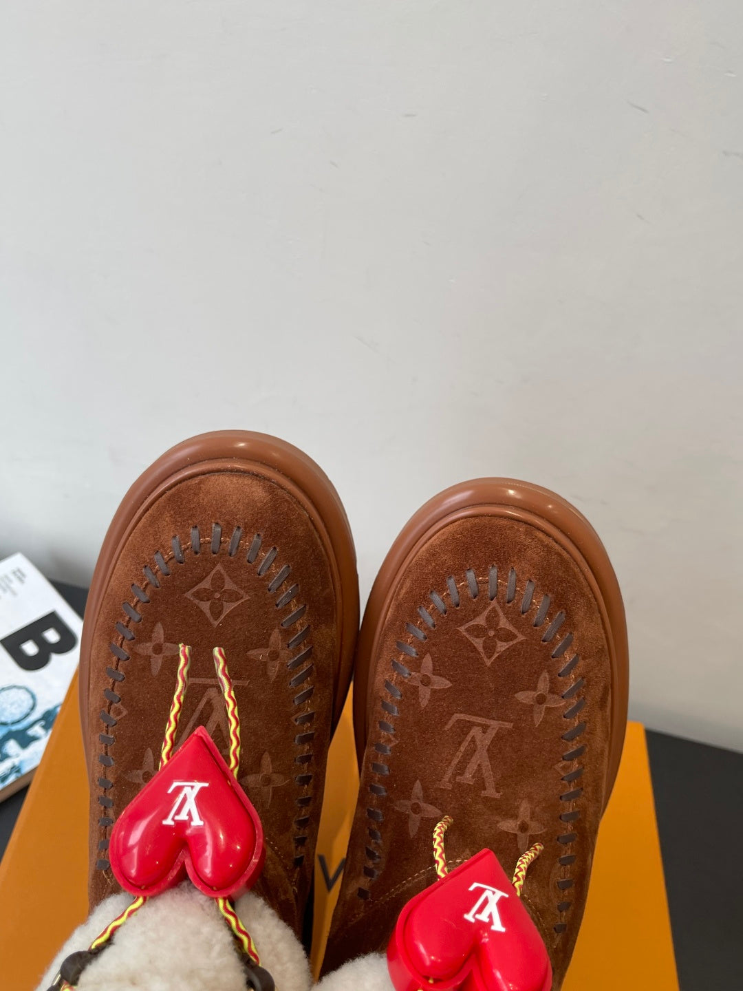 Louis Vuitton monogram suede boots with shearling trim, red heart charms and chunky sole