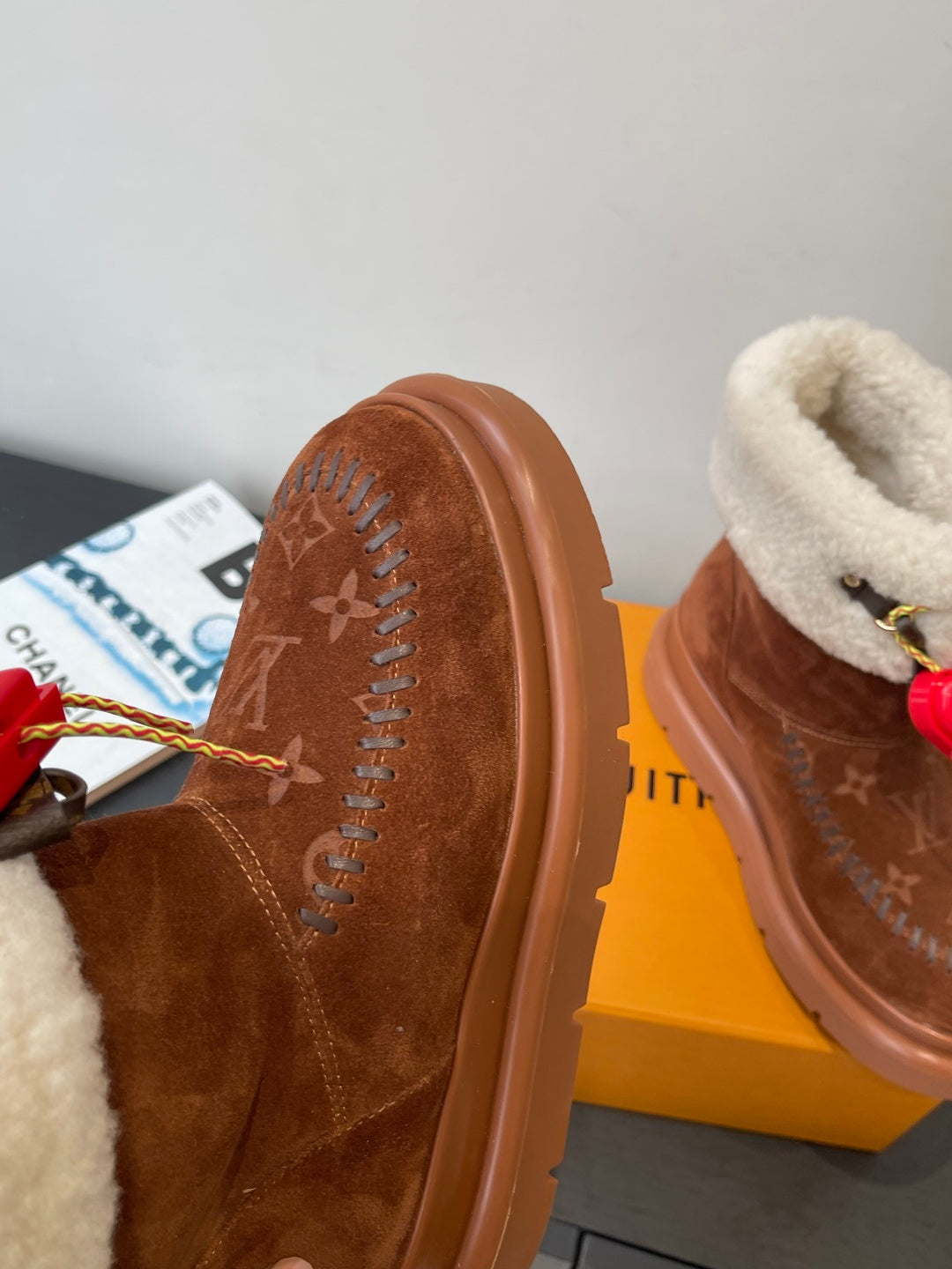 Louis Vuitton monogram suede boots with shearling lining and red heart lace charms