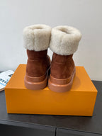 Louis Vuitton monogram suede ankle boots with shearling cuffs and brown rubber soles