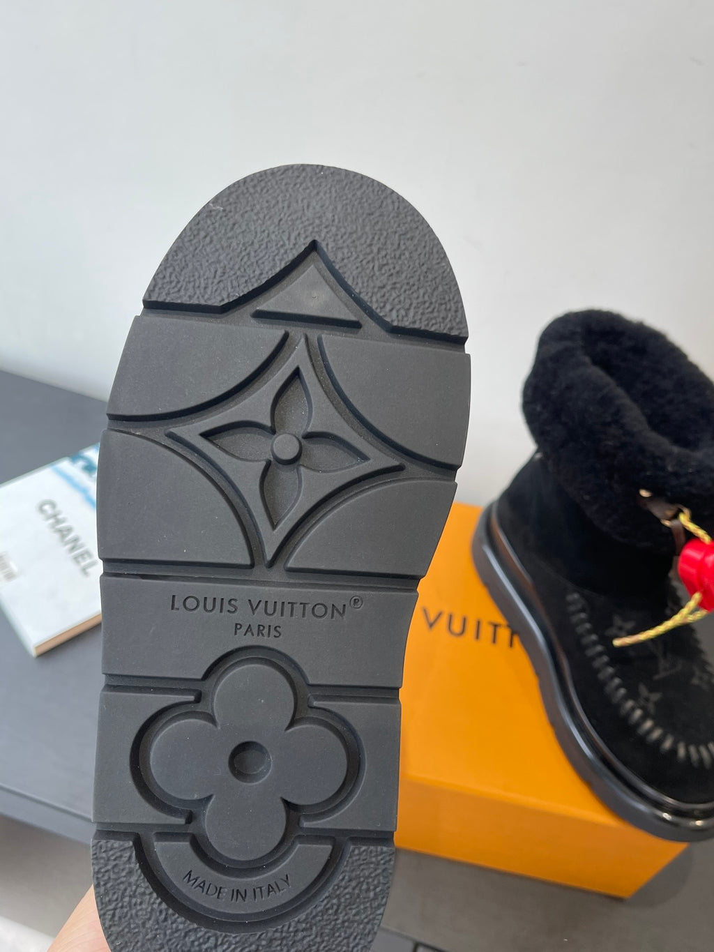 Black rubber sole of monogram ankle boot with molded Louis Vuitton logo