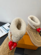 Louis Vuitton unisex tan suede shearling boots, cuff detail with red heart charm