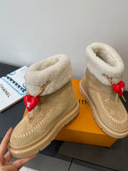 Louis Vuitton unisex tan suede shearling boots, red heart charm and monogram panel