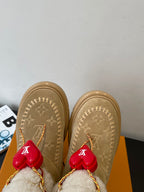 Louis Vuitton unisex tan suede shearling boots, top view with red heart charm tassels