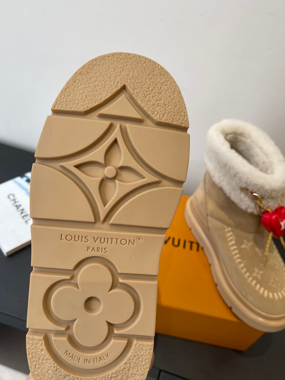 Louis Vuitton boot outsole in tan with embossed floral logo and “Louis Vuitton Paris”