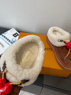Shearling-lined brown suede slide with beige insole patch and red heart detail