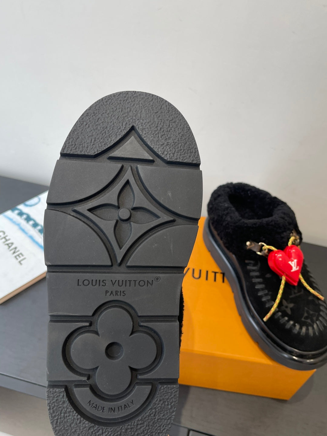 Black rubber outsole with floral LV emblem and “Louis Vuitton” text