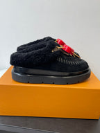 Black shearling slide shoe with red heart LV charm on braided cord strap