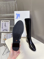 Burberry black knee-high leather boots, view of outsole and rounded toe