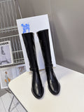 Burberry black knee-high leather boots, pull-on style with low stacked heel