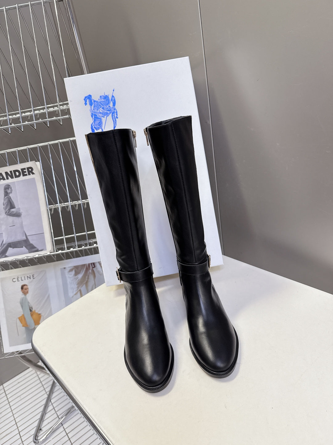 Burberry black knee-high leather boots, pull-on style with low stacked heel