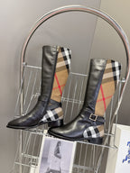 Burberry pair of black knee-high leather boots with plaid panels and buckle details