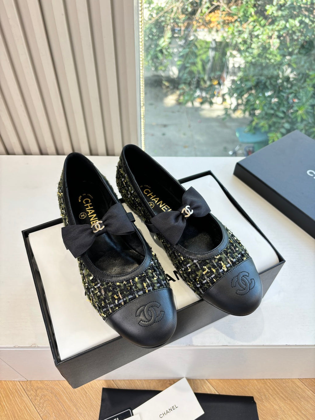 Pair of black Chanel ballet flats with bow and tweed-trim upper