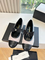 Two black and tweed ballet flats with ribbon bow and embossed logo on toe