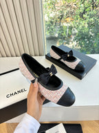 Black and pink tweed ballet flats with front ribbon bow and gold logo plaque