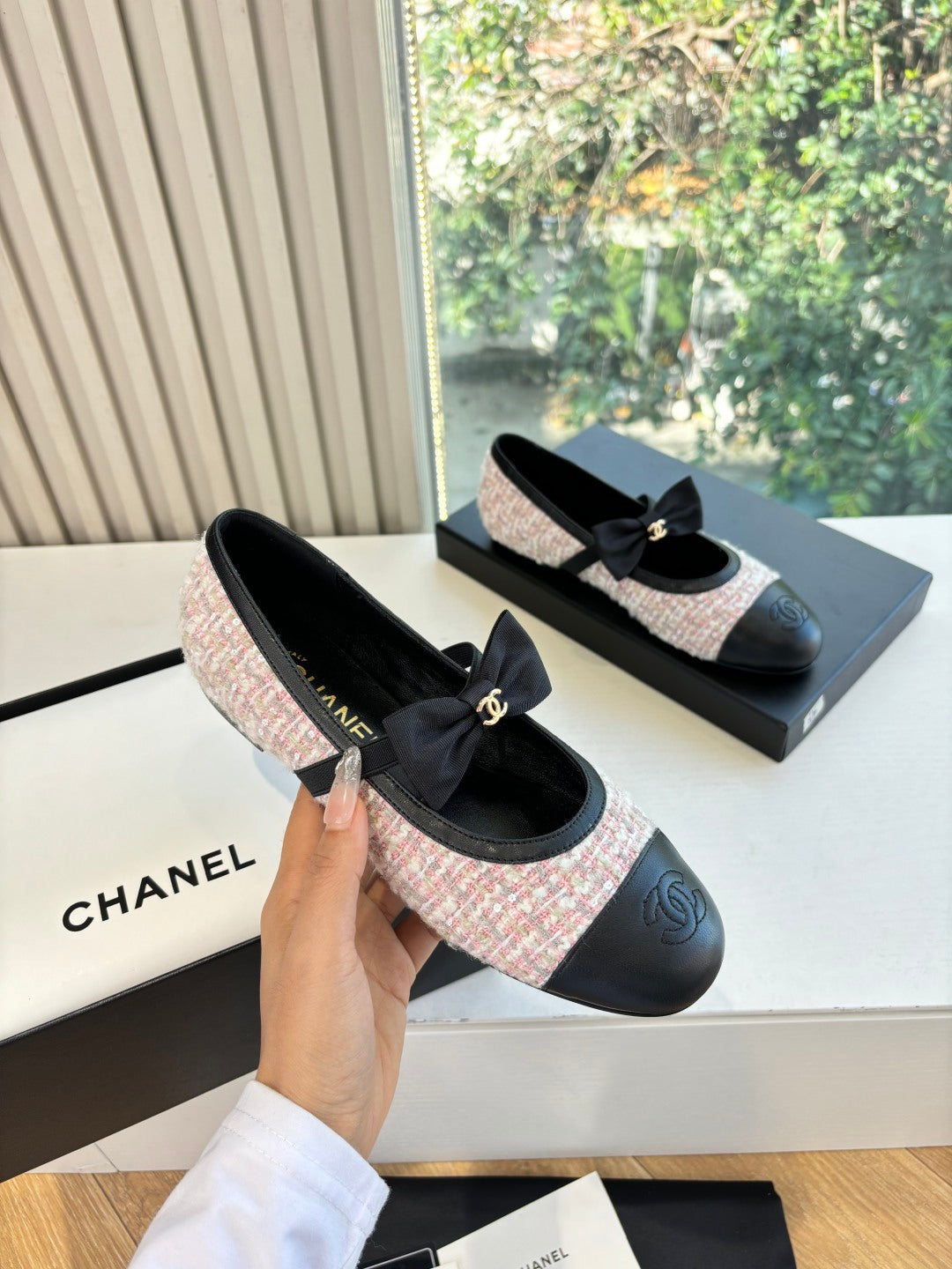 Black and pink tweed ballet flats with front ribbon bow and gold logo plaque
