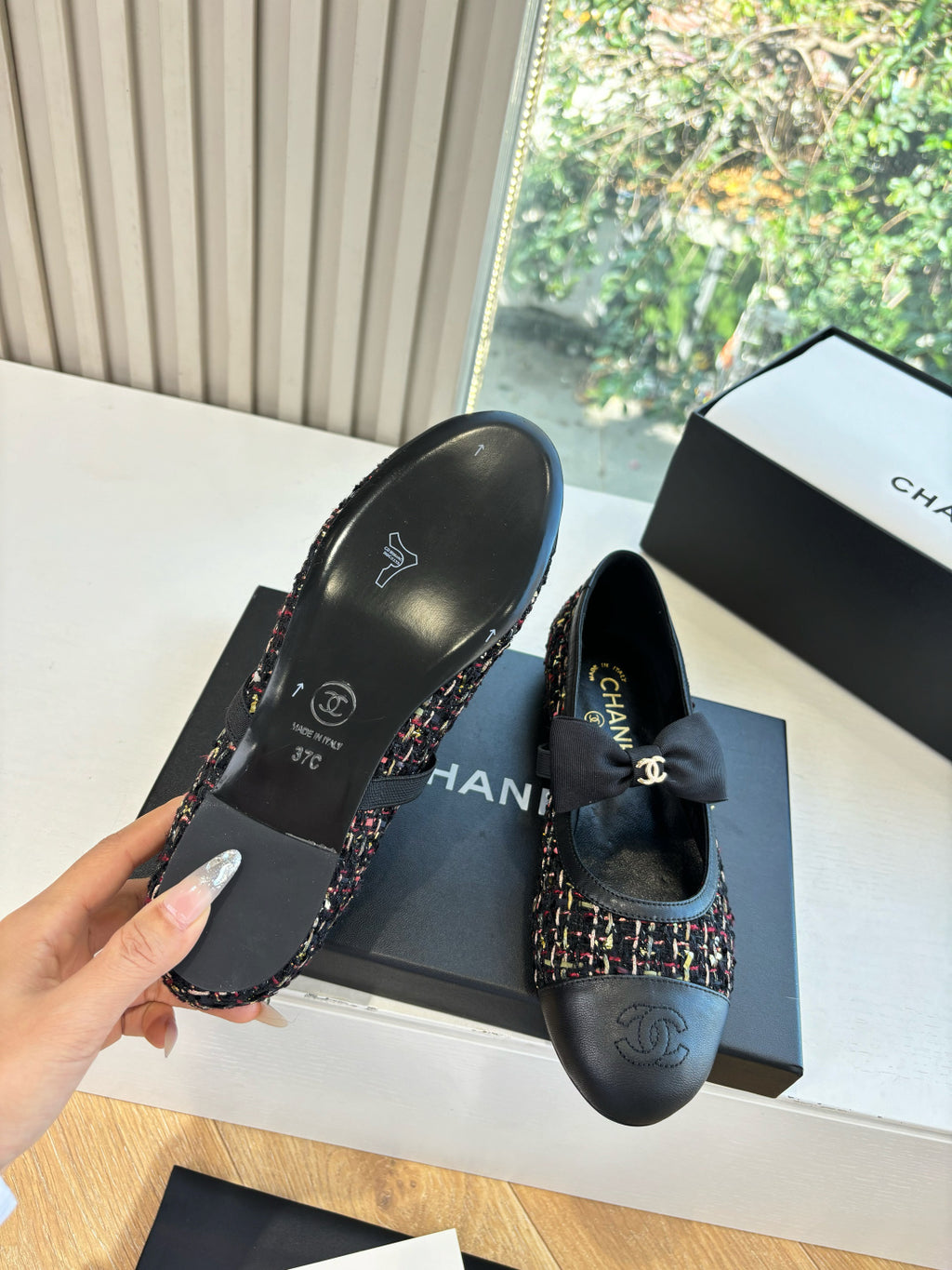 Black Chanel slip-on shoes with multicolor tweed trim and back heel logo