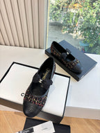 Black Chanel loafers with multicolor tweed panels and black bow on top