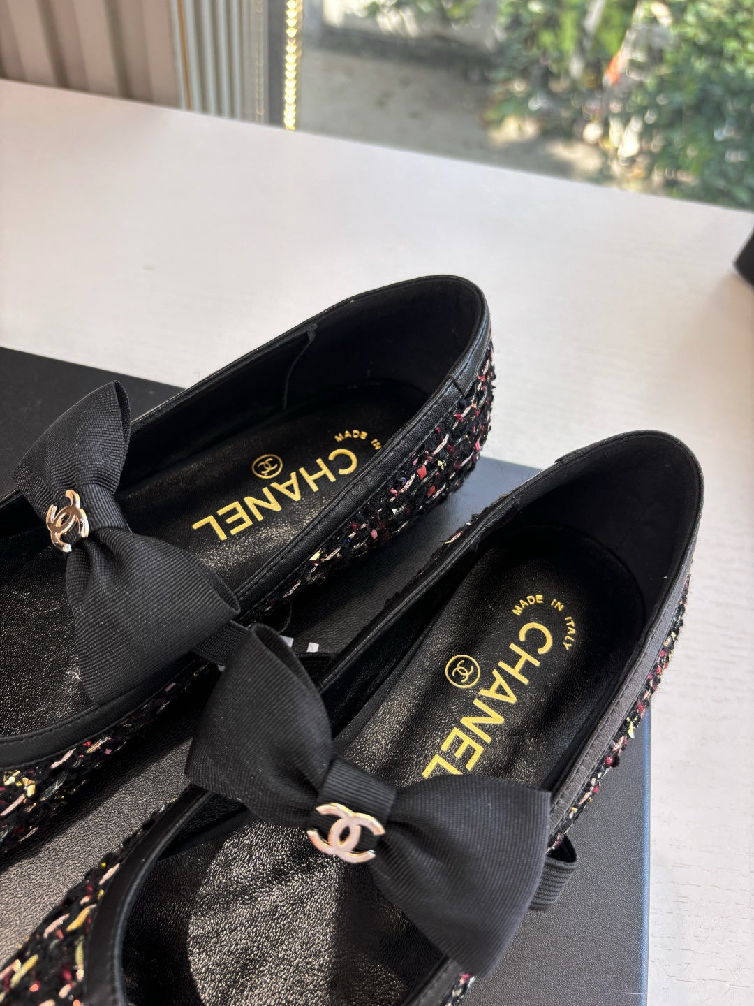 Black Chanel loafers detail: multicolor tweed upper with CC logo and satin bow