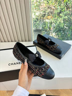 Black Chanel slip-on flats with multicolor tweed side panels and satin bow