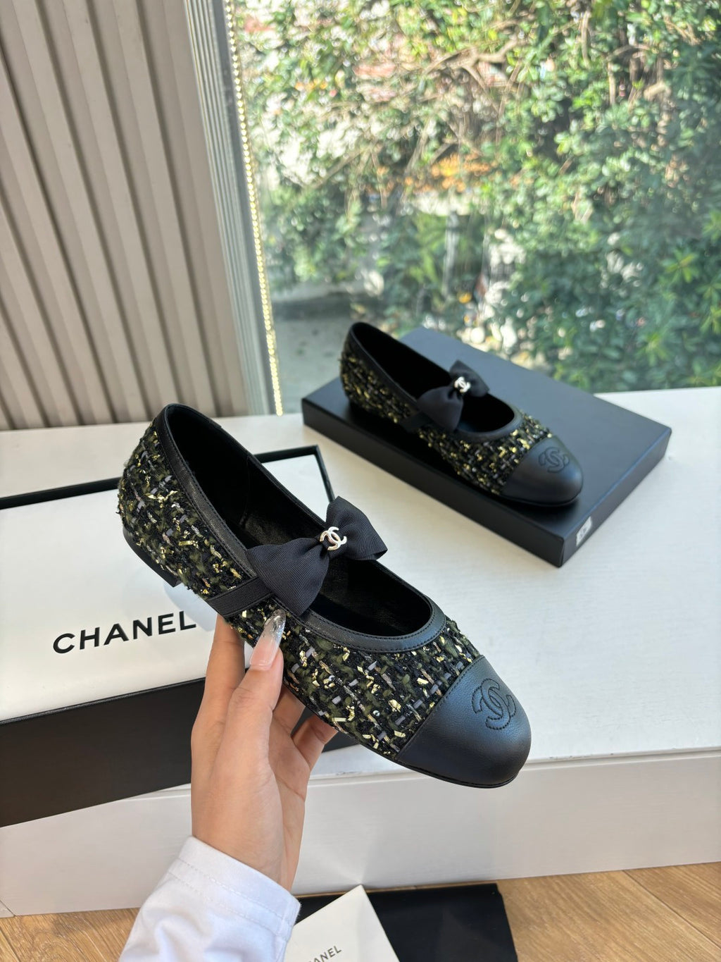 Black Chanel flats with side bow and tweed quarter panel detail