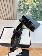 Black Chanel flats with bow detail and multicolor tweed panel on toe