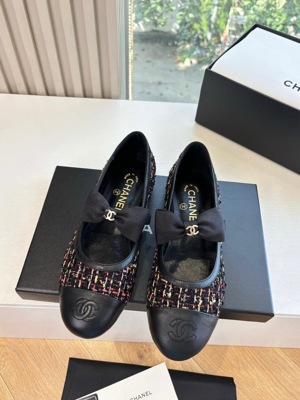 Black Chanel flats with multicolor tweed trim and bow at instep