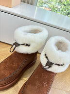 Louis Vuitton unisex brown suede boots with cream shearling straps and decorative stitching