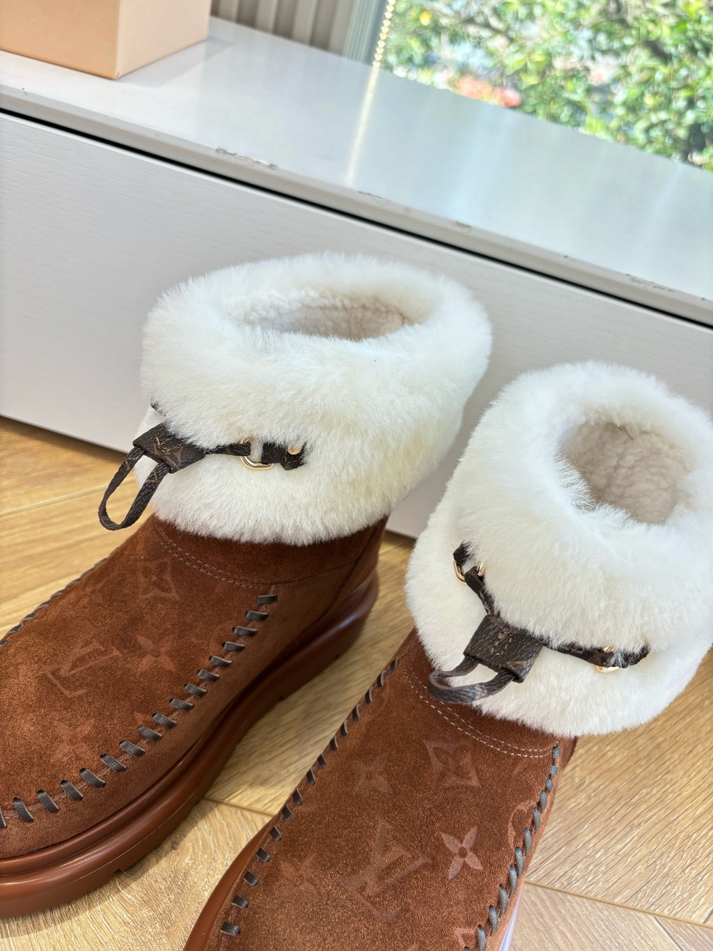 Louis Vuitton unisex suede ankle boots with cream shearling lining and black strap detail