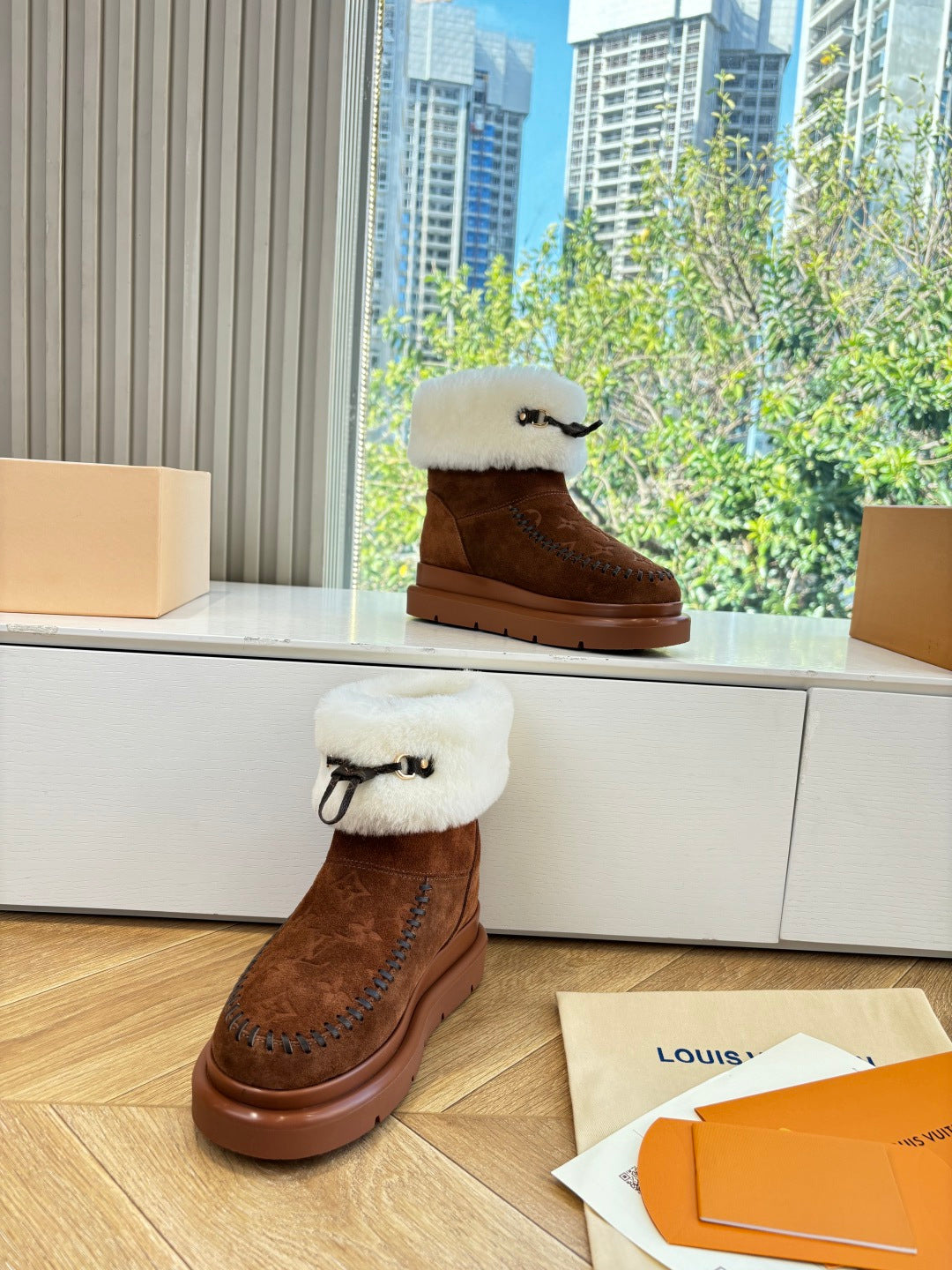 Louis Vuitton ankle boots, dark brown suede with cream fur cuffs and monogram pattern on side