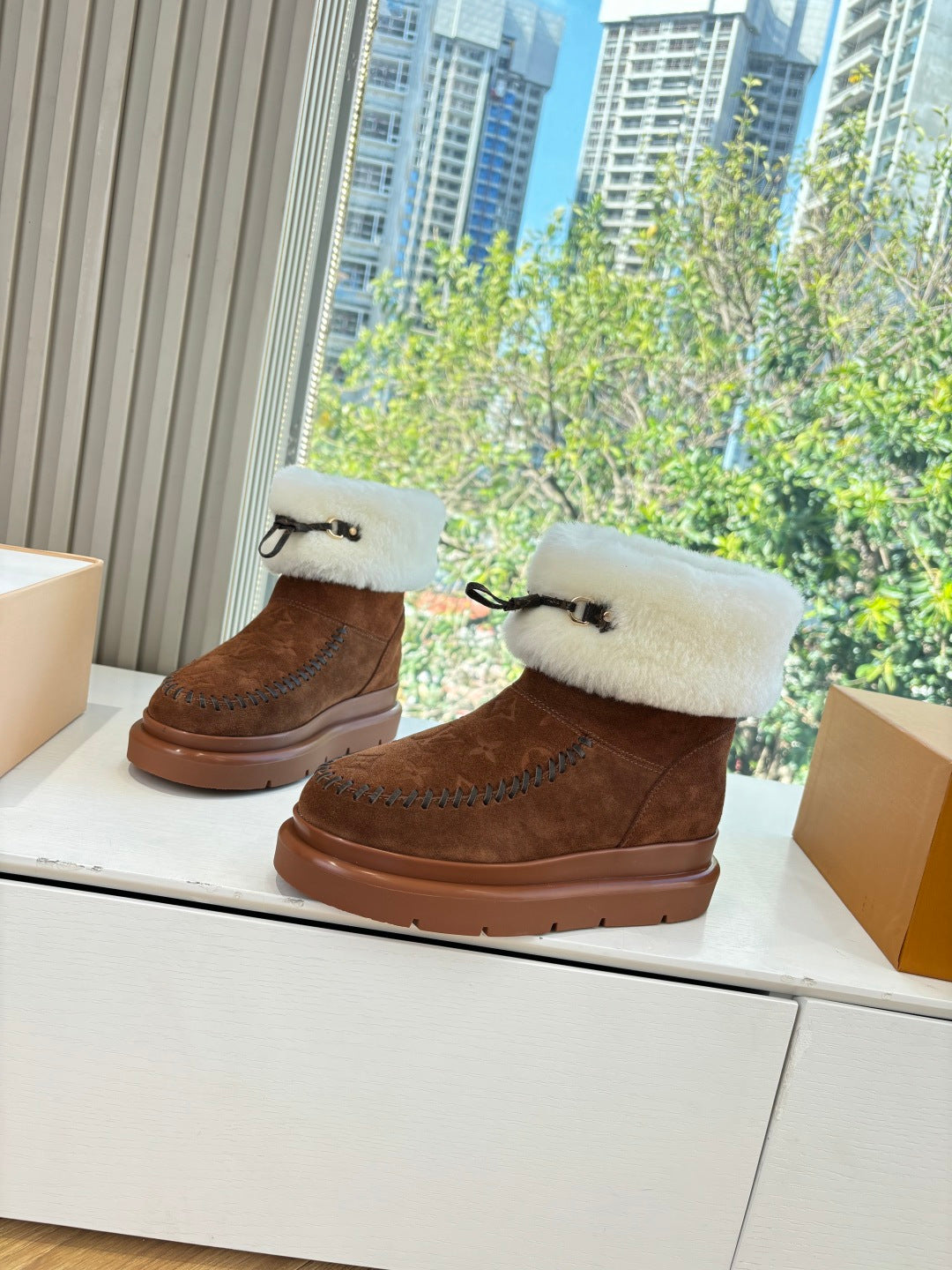 Louis Vuitton ankle boots pair, dark brown suede with cream fur cuffs and bow strap