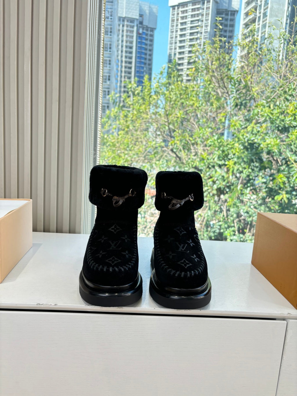 Louis Vuitton unisex black ankle boots with fur collar, buckle, and monogram pattern