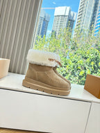 Louis Vuitton unisex ankle boots in tan suede with white shearling cuff and leather strap