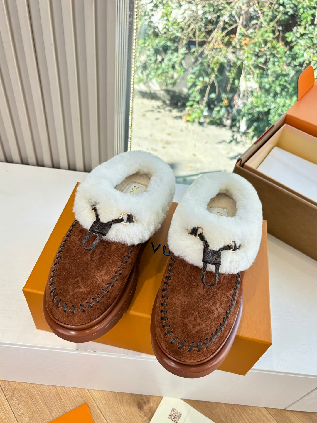 Louis Vuitton shearling-lined loafers pair, brown monogram suede with white shearling