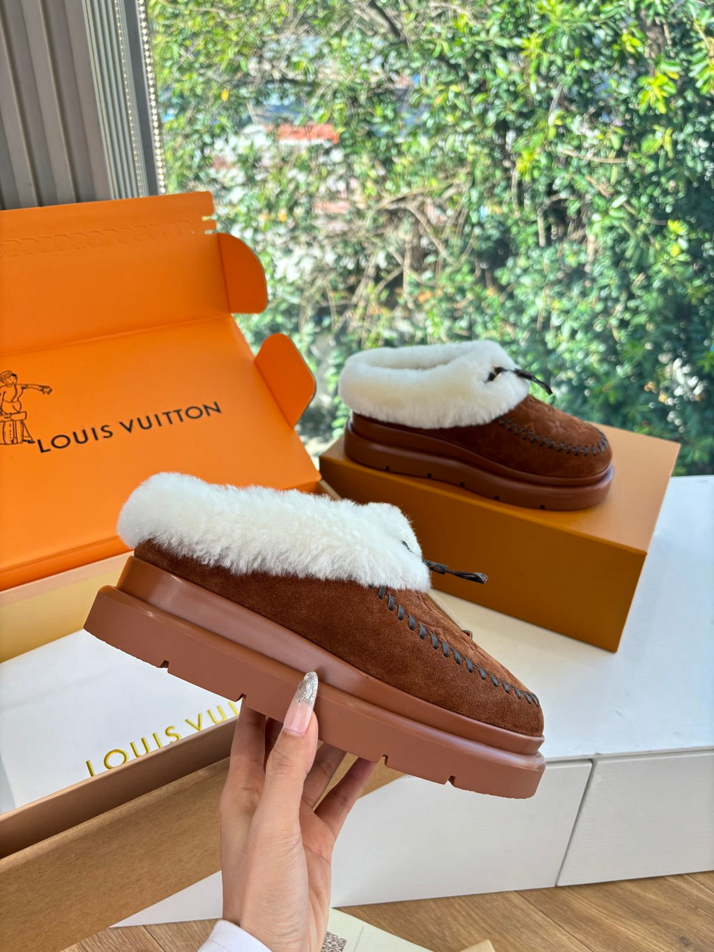 Louis Vuitton shearling suede loafers on hand, brown with white fur lining