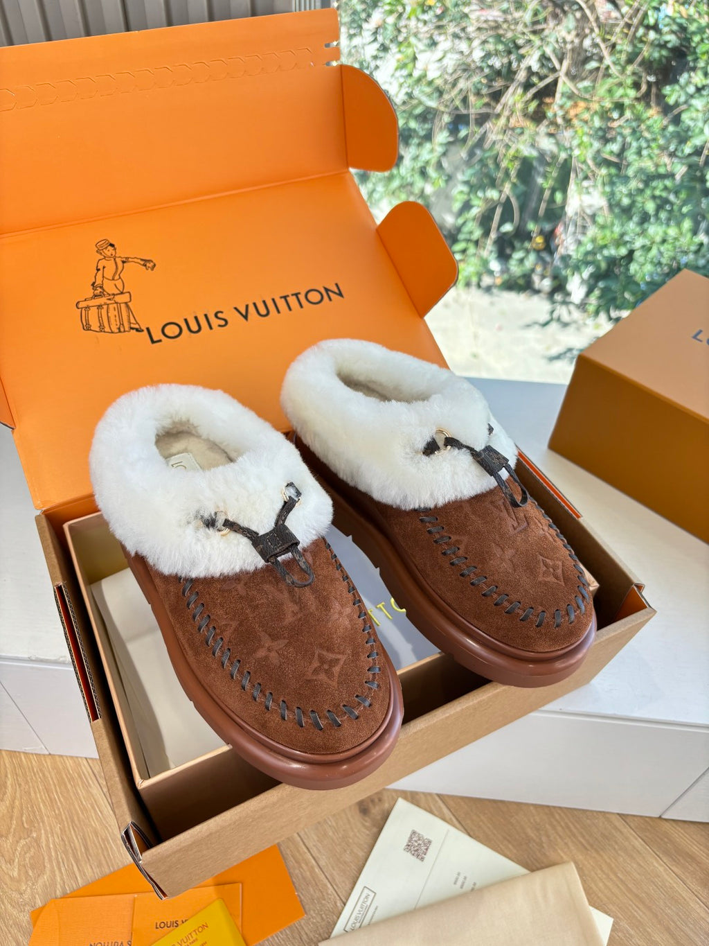 Louis Vuitton shearling-lined loafers, brown suede with monogram, dark lace trim