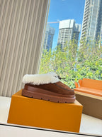 Louis Vuitton shearling loafers on box, brown suede with white fur upper