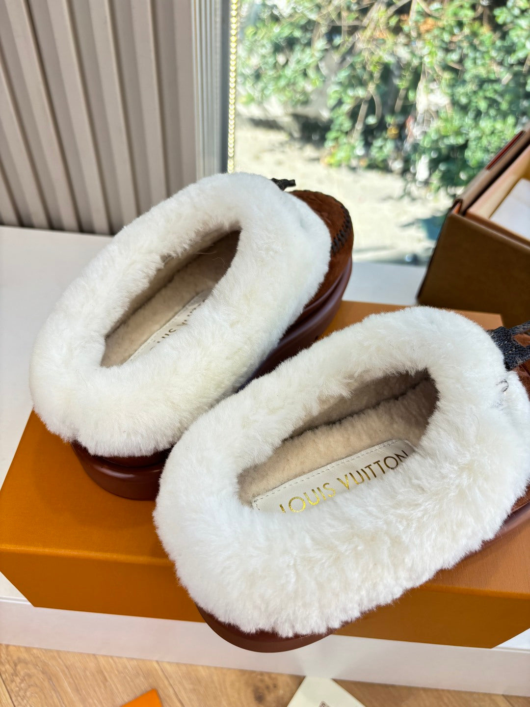 Louis Vuitton shearling-lined loafers, brown suede with white fur loop upper