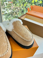 Louis Vuitton shearling moccasin shoe detail, tan monogram suede and white fur cuff
