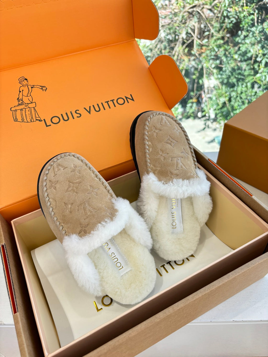 Louis Vuitton shearling moccasin slippers, tan suede with white cross-over fur