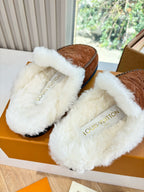 White fleece-lined slippers with brown monogram suede and Louis Vuitton logo
